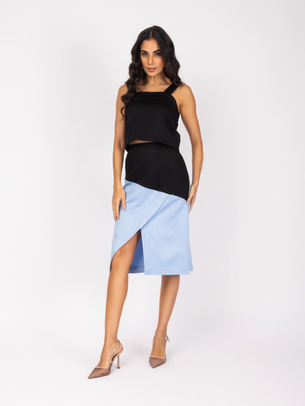 Elegant black and blue midi skirt and blouse set with a modern, asymmetrical design.