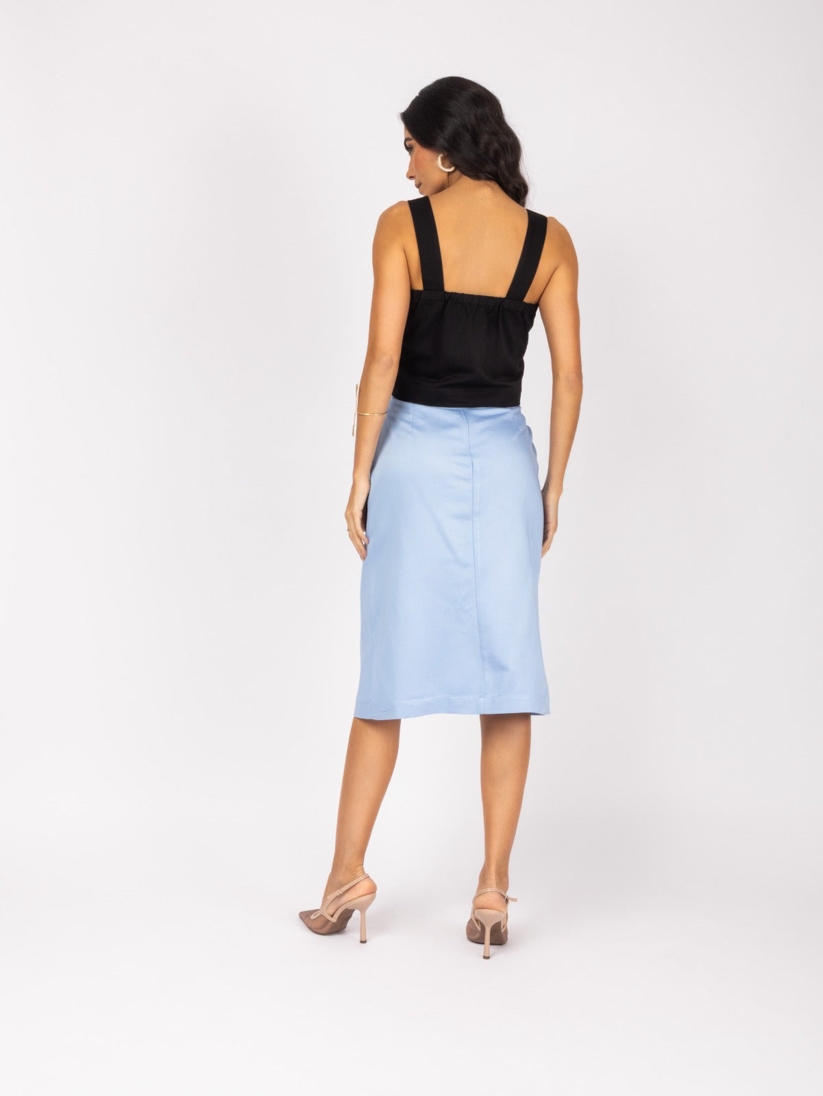 Elegant black and blue midi skirt and blouse set with a modern, asymmetrical design.